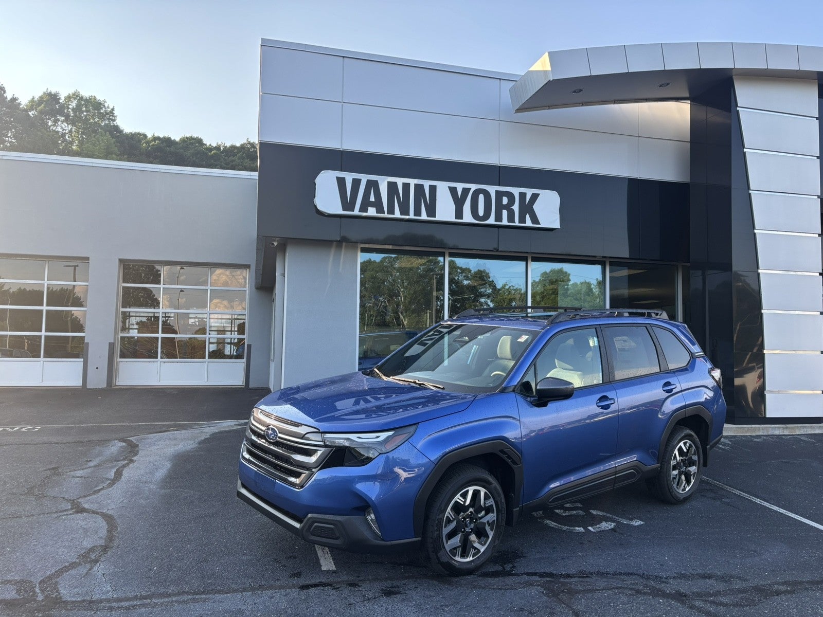 2026 Subaru FORESTER Premium in Daybreak Blue Pearl — front three-quarter view