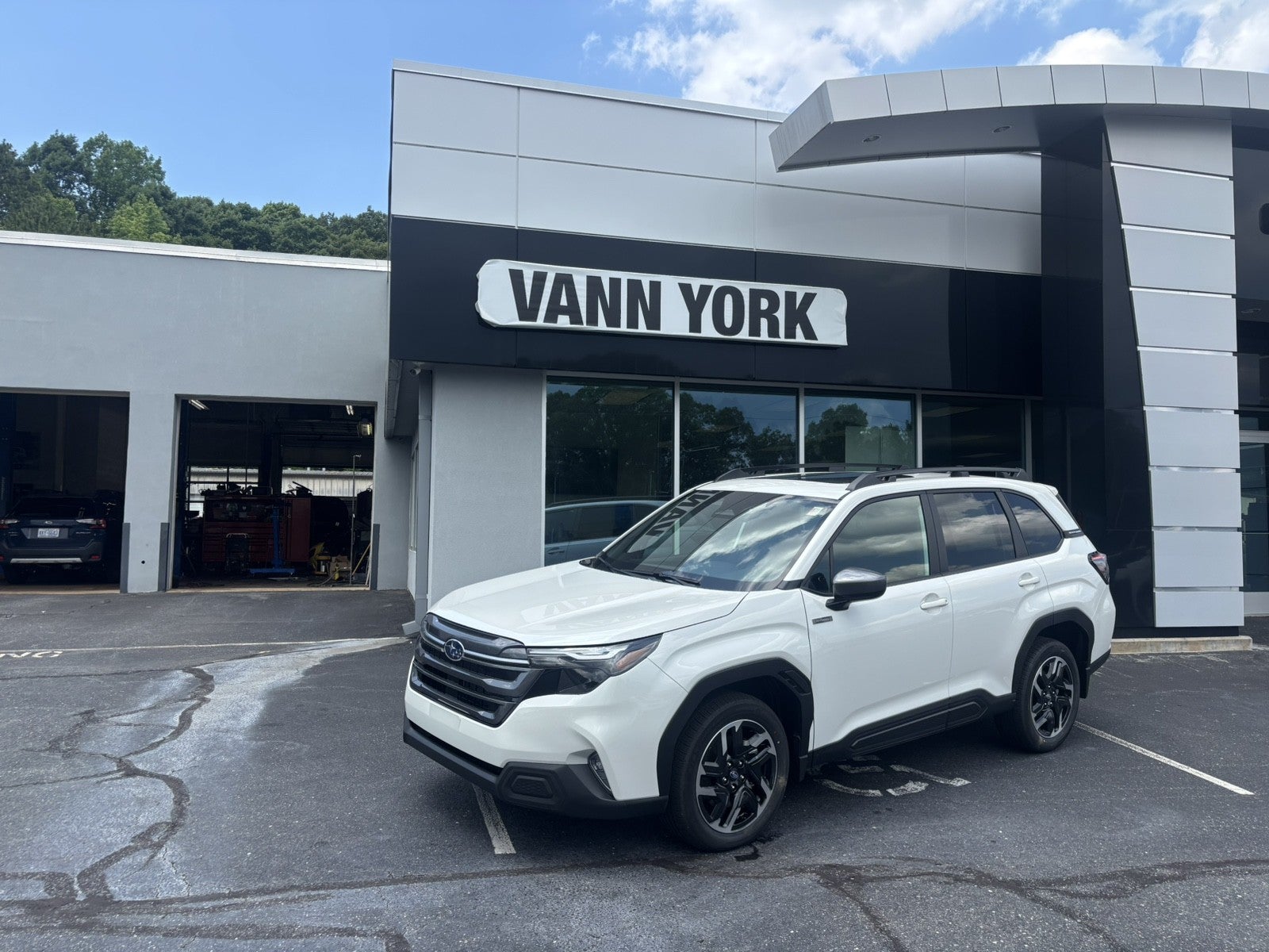 2026 Subaru FORESTER Premium Hybrid in Crystal White Pearl — front three-quarter view