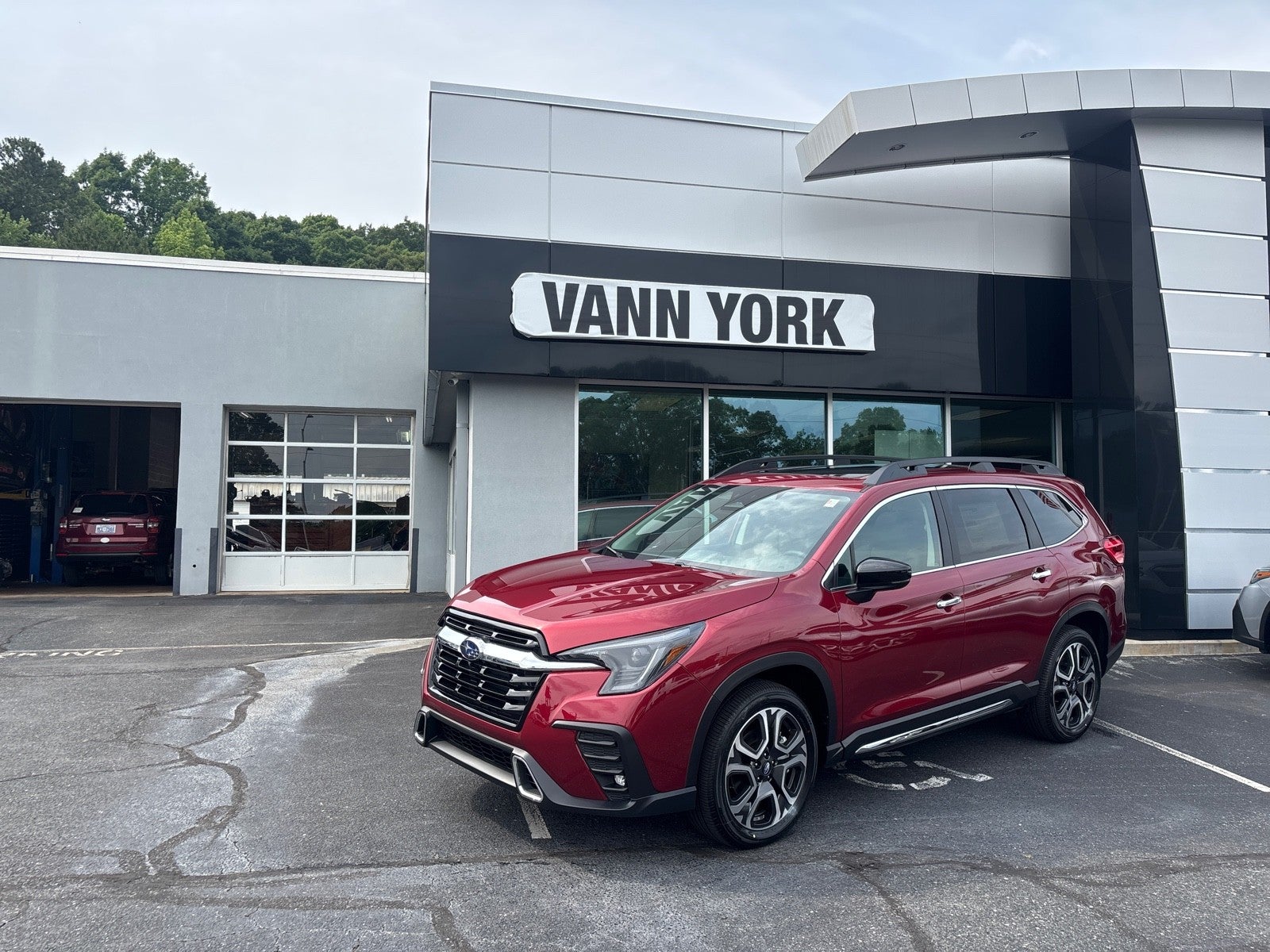 2026 Subaru ASCENT Touring 7-Passenger in Crimson Red Pearl — front three-quarter view