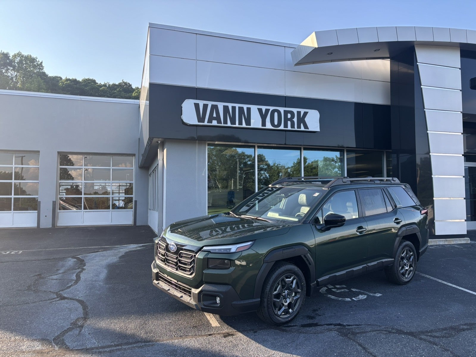 2026 Subaru OUTBACK Premium in Deep Emerald Green Pearl — front three-quarter view