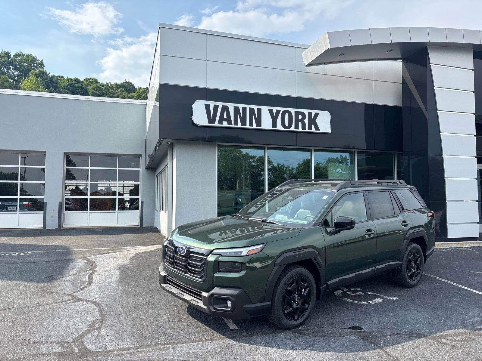 2026 Subaru OUTBACK Limited in Deep Emerald Green Pearl — front three-quarter view