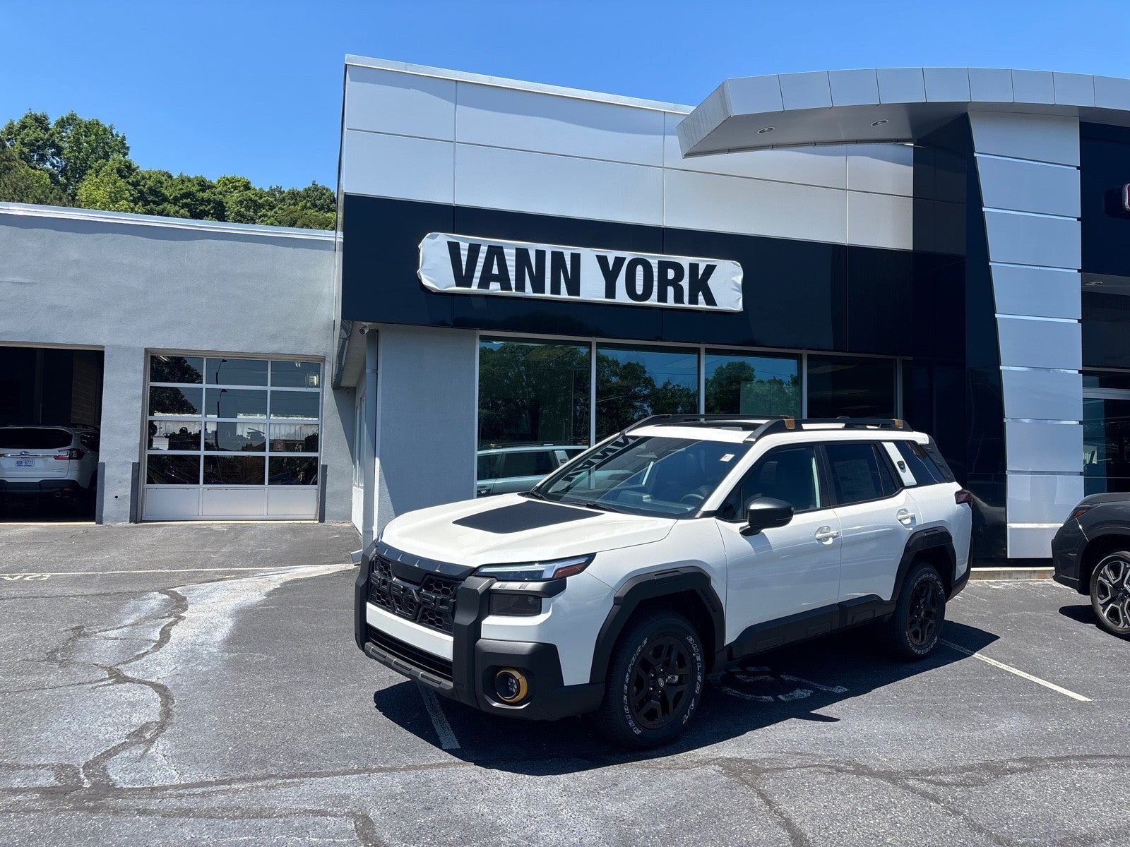 2026 Subaru OUTBACK Wilderness in Crystal White Pearl — front three-quarter view