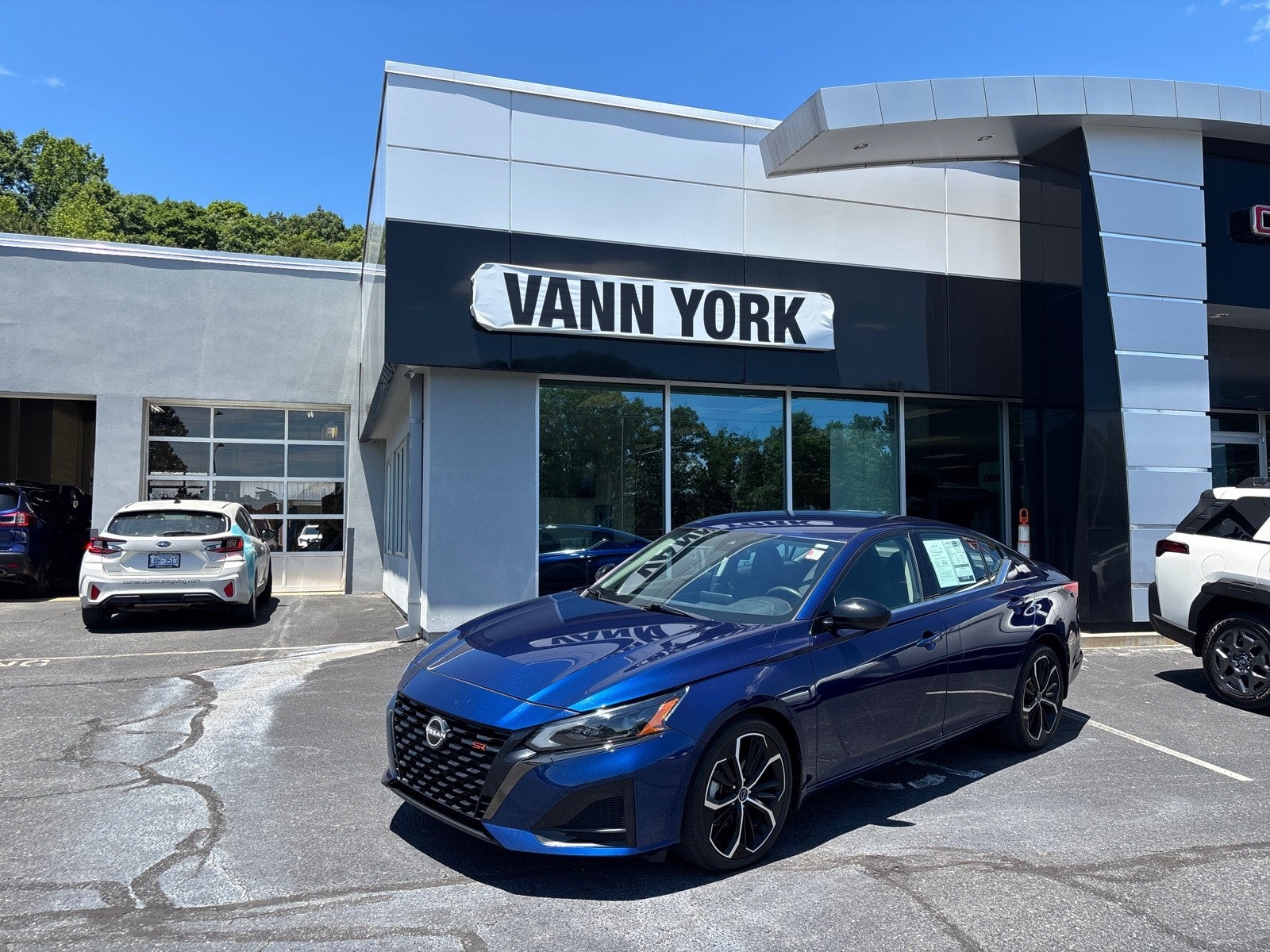 2023 Nissan Altima 2.5 SR in Deep Blue Pearl — front three-quarter view
