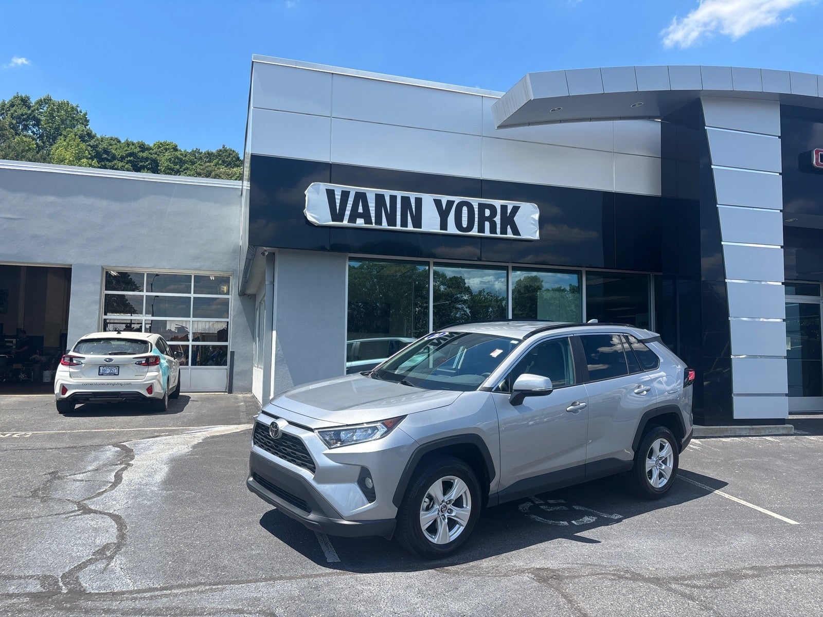 2021 Toyota RAV4 XLE in Silver Sky Metallic — front three-quarter view
