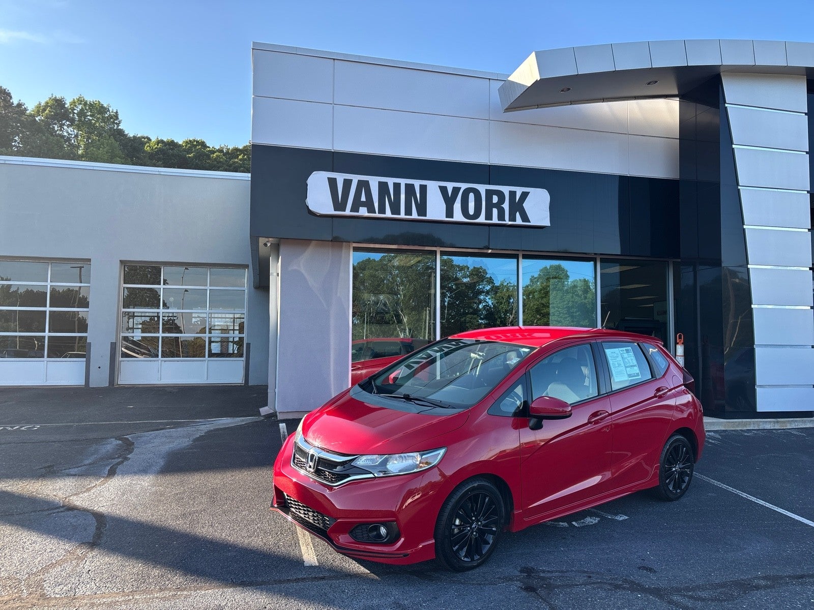2018 Honda Fit Sport in Red — front three-quarter view